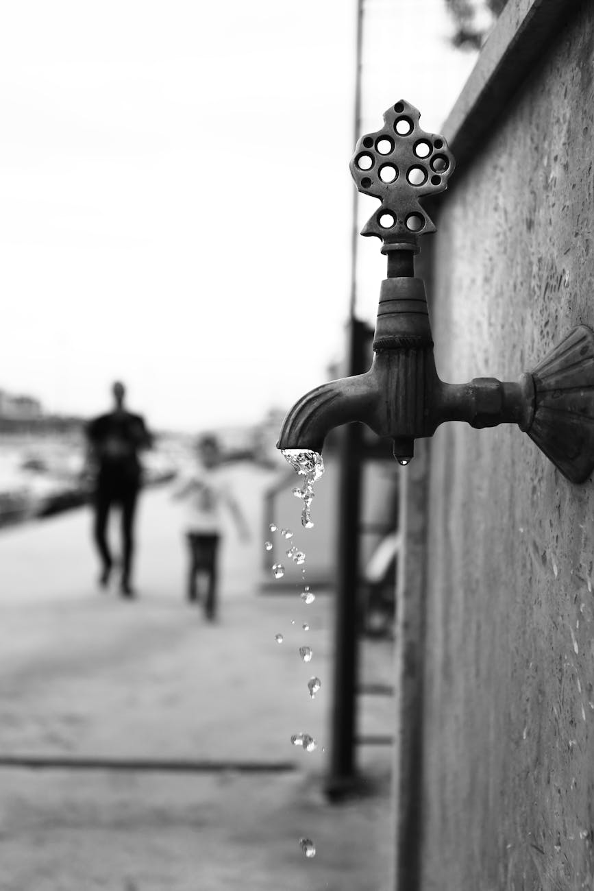 grayscale photography of a faucet