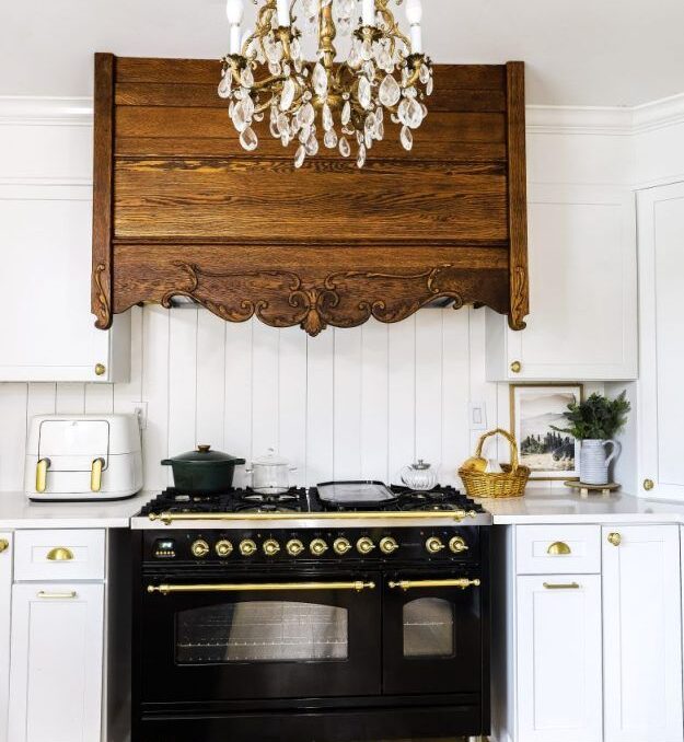 Wooden range hood in white kitchen