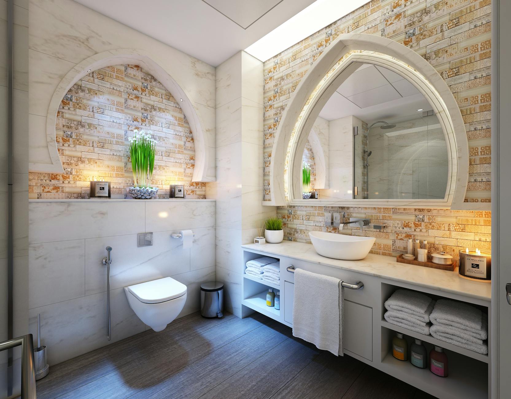 white bathroom with stone wall and arched mirrors