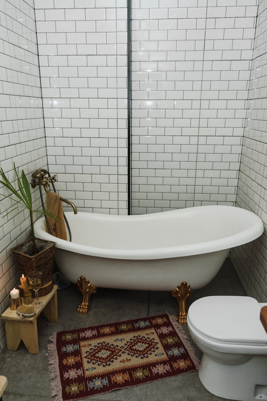 a white clawfoot bathtub in the bathroom