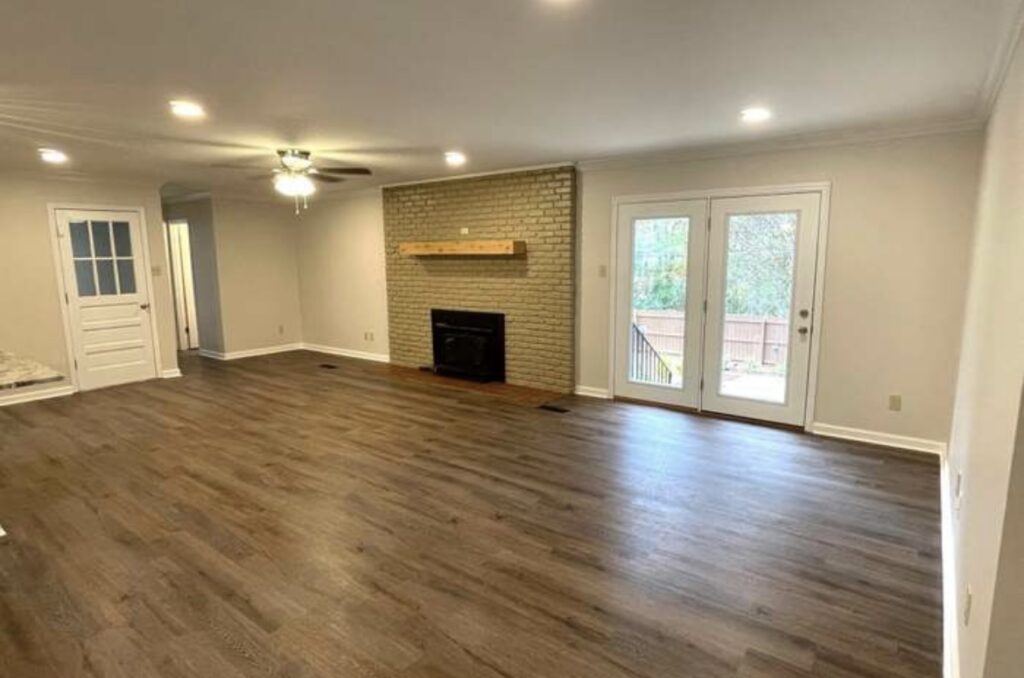 beige fireplace in empty white living room